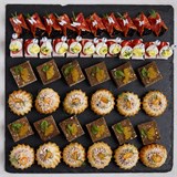 Роллы из итальянской колбасы Чоризо с прованской тапенадой и икрой Тобико на эко-декоре, Канапе с индейкой, ложным яйцом, помидоркой Черри и муссом из кукурузы, Медовик из бородинского хлеба с сыром Фета, дижонской горчицей в декоре из икры, Пти-шу открытый с творожным сыром, вяленой сливой и арахисовыми хлопьями